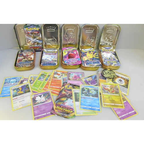 650 - A collection of Pokemon tins including cards and nineteen Black Star and promo cards