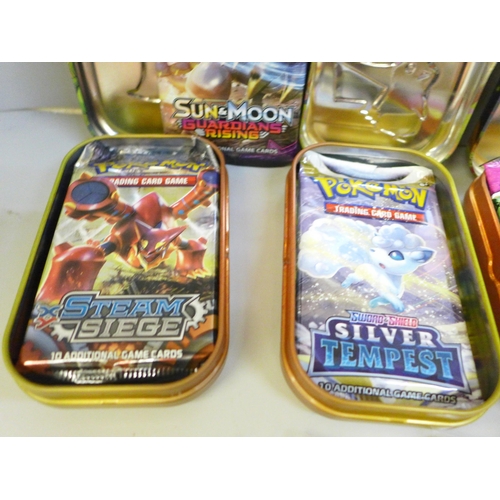 650 - A collection of Pokemon tins including cards and nineteen Black Star and promo cards