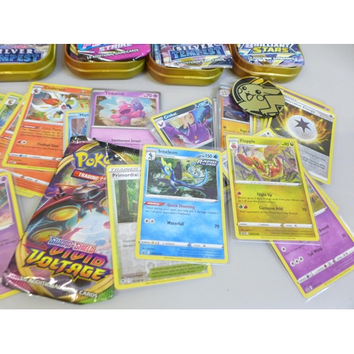 650 - A collection of Pokemon tins including cards and nineteen Black Star and promo cards