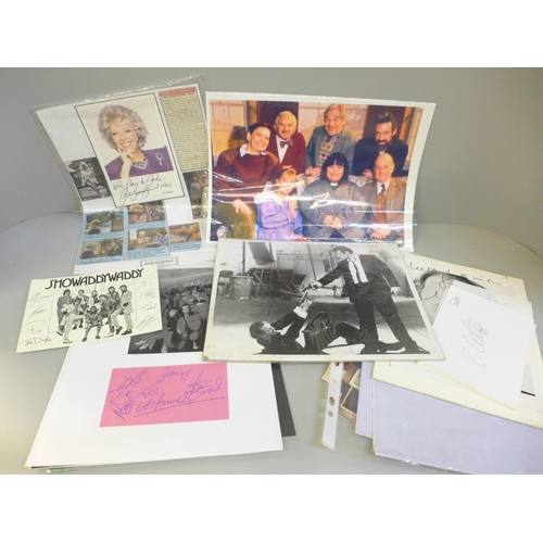 656 - Show business autographs including Tom Selleck, Leslie Nielsen, Status Quo, Tiswas team, Paul Whiteh... 