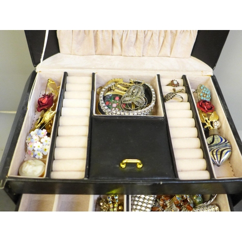 659 - A case of costume jewellery and wristwatches including lady's Seiko and Rotary