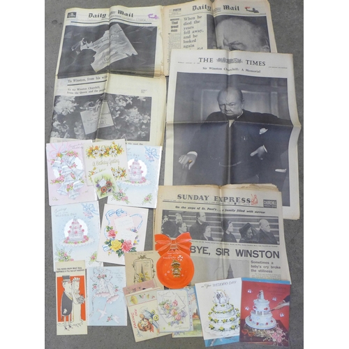 669 - A collection of mid-20th Century greetings cards and commemorative newspapers including Churchill