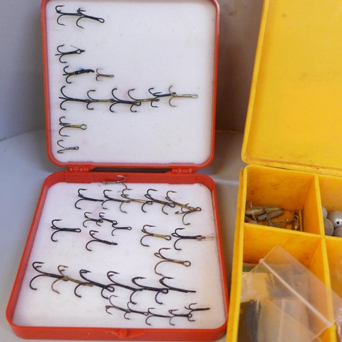 671 - A case of fishing lures, a case of weights, swivels and a case of hooks