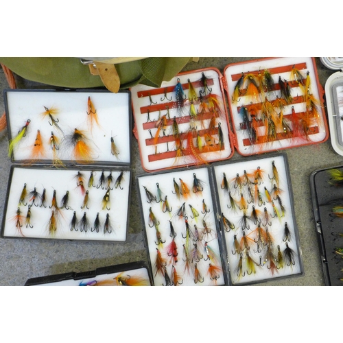 715 - A Lureflash fly tying kit and eight boxes of fishing flies in a fishing tackle bag