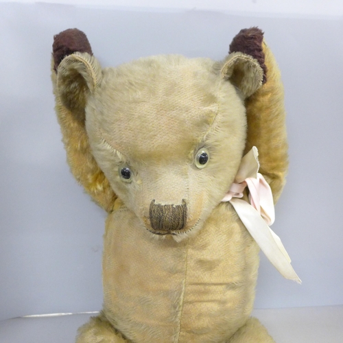 730 - A large vintage Teddy Bear with jointed limbs