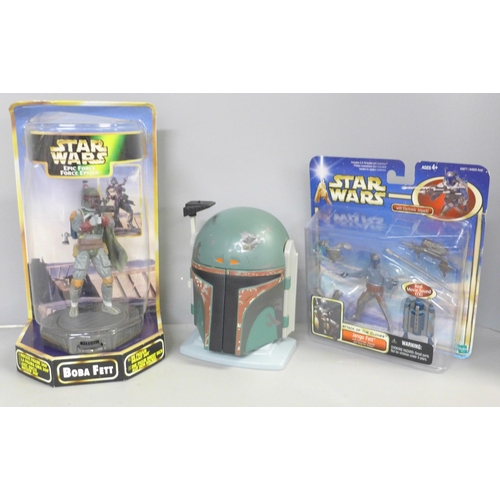 736 - Star Wars, Boba Fett and Jango Fett figures, boxed and a Boba Fett model helmet