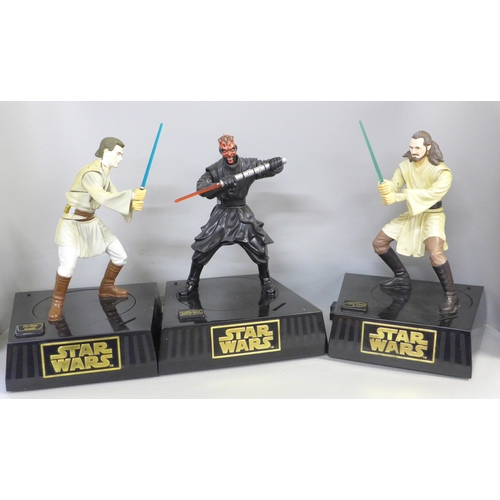 756 - Three circa 2000 Star Wars money boxes and two storage containers