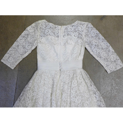 765 - A lace wedding dress, with photograph of it worn at a Wedding ceremony in 1961 by the vendors mother... 