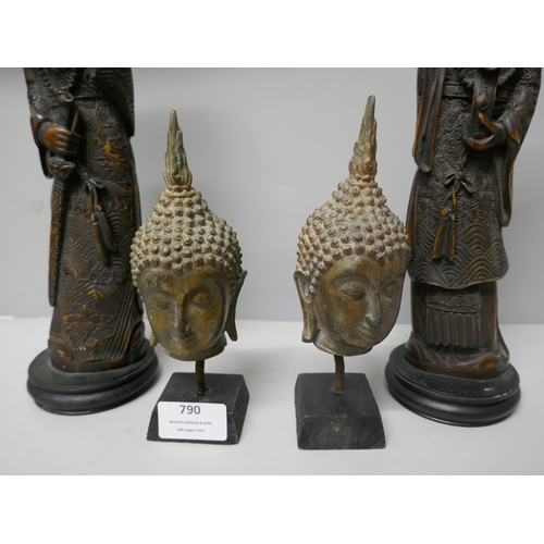 790 - A pair of resin oriental figures and a pair of metal Thai deity heads on stands