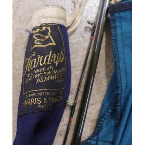 801 - A Hardy 275cm trout rod, a Daiwa graphite salmon rod CF98 12 plus a salmon measuring stick (3)