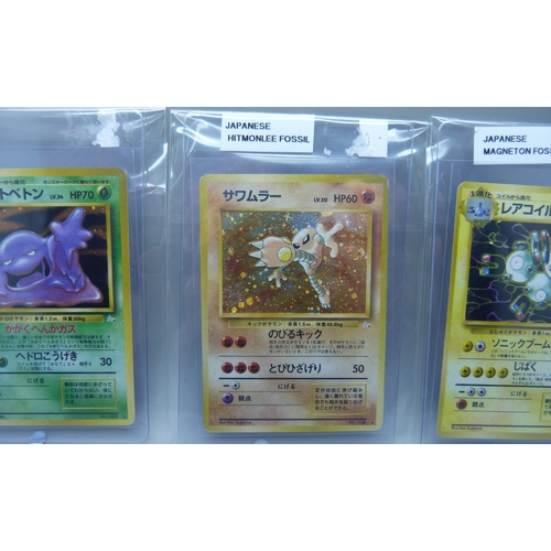 832 - Three vintage Japanese holographic cards - Magneton, Hitmonlee and Muk