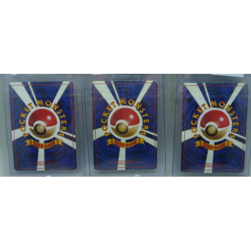 832 - Three vintage Japanese holographic cards - Magneton, Hitmonlee and Muk