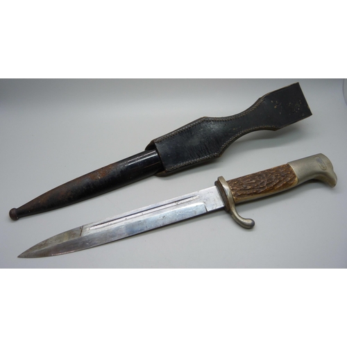 837 - A German bayonet with scabbard, horn handle, the blade marked Horster, Solingen **PLEASE NOTE THIS L... 