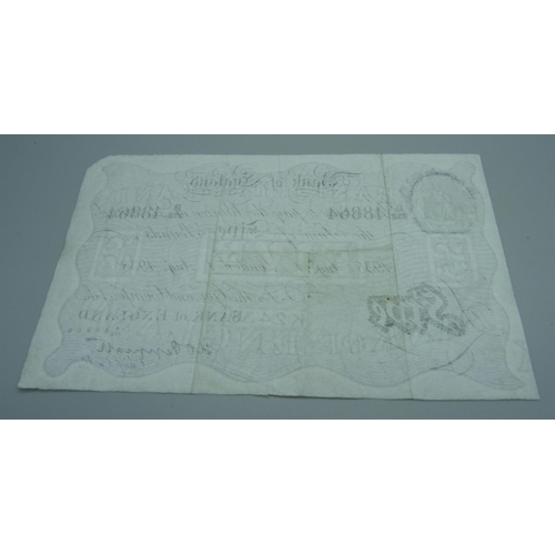 840 - A 1938 white £5 note, Peppiatt Chief Cashier, one corner missing