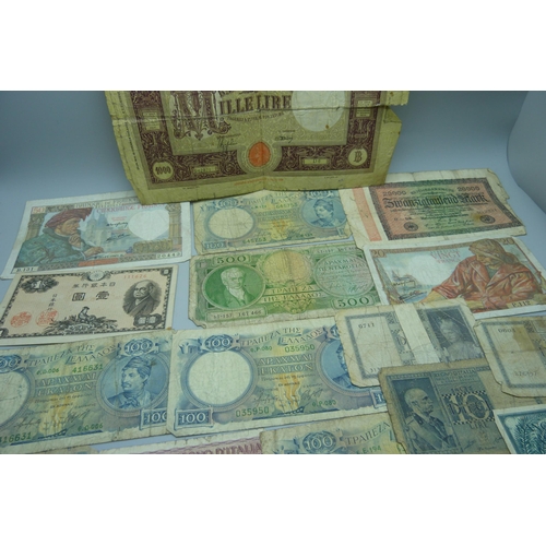 841 - A collection of foreign banknotes including a North Korea 100 Won note