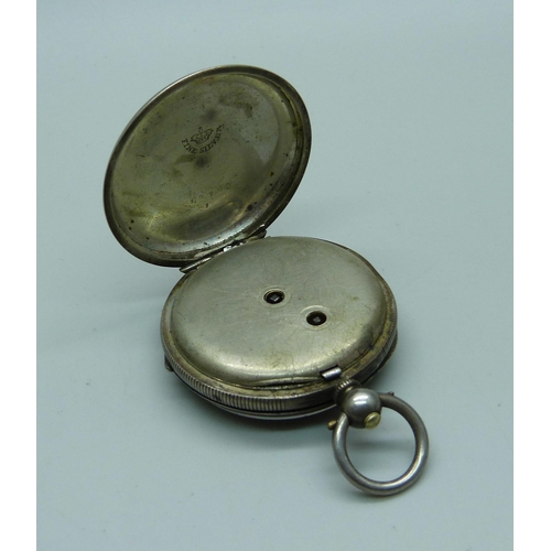 858 - A fob watch on a plated stand