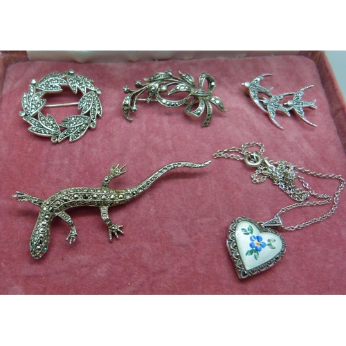 860 - A silver and enamelled locket and chain and four marcasite set brooches, (two marked 925, not lizard... 