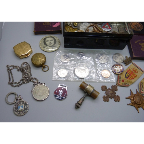 861 - An assortment of badges, commemorative medals, sovereign holder, etc.