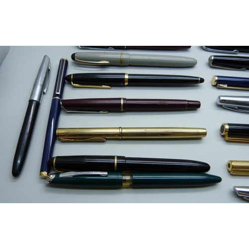 886 - A collection of fountain pens and ballpoint pens