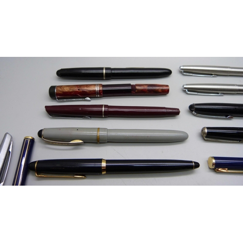 886 - A collection of fountain pens and ballpoint pens