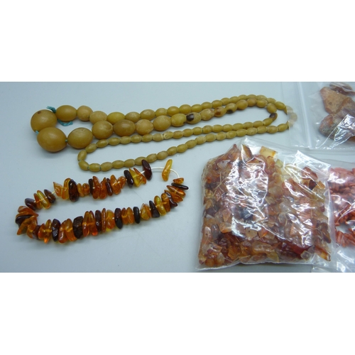 897 - A collection of rough and loose amber, loose coral, etc.