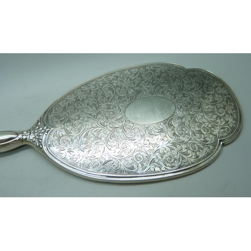 913 - A four piece silver hand mirror set and one other silver comb