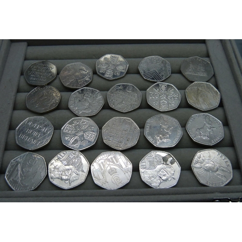 915 - A collection of twenty-one 50p coins, twenty special issues and one cased