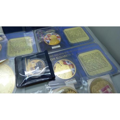 916 - A collection of commemorative and special issue coins, including four Kings oval gold plated coins s... 