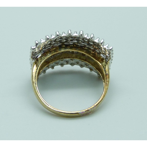 950 - A 9ct gold and diamond ring, 4.1g, L