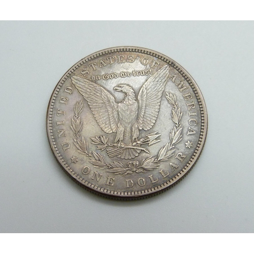 973 - An 1884 US silver Morgan dollar