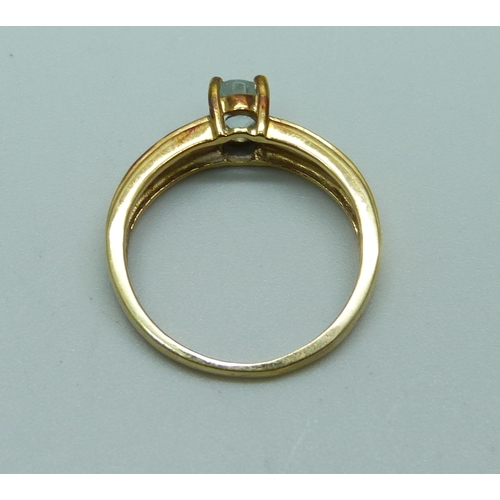 992 - A 9ct gold stone set ring, 2.3g, L