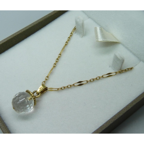 999 - A 9ct gold and crystal pendant and chain, (chain 2.1g) and a pearl necklace with jade pendant and 14... 