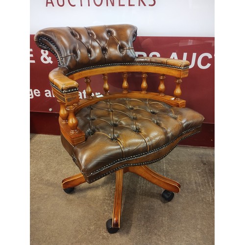 95A - A beech and chestnut brown leather Captains revolving desk chair