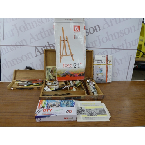 2337 - A box of assorted art supplies including oil paints, brushes, easels, paint box, etc.