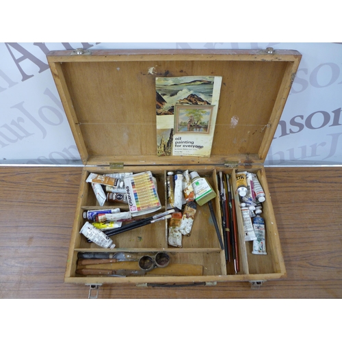 2337 - A box of assorted art supplies including oil paints, brushes, easels, paint box, etc.