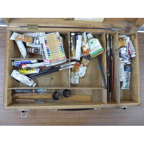 2337 - A box of assorted art supplies including oil paints, brushes, easels, paint box, etc.