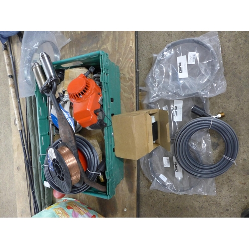 2347 - A box of assorted unused parts and consumables including: an air hose, band saw blades, a winch wire... 