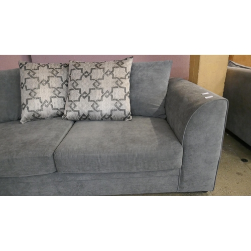 1511 - A pewter velvet three seater sofa - Brand new RRP £540