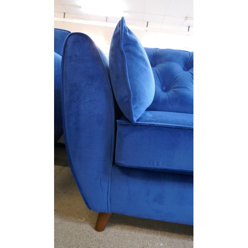 1513 - A blue velvet Hoxton four seater sofa - Brand new, RRP £899