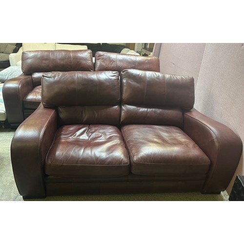 1520 - A cognac leather three seater sofa and two seater sofa