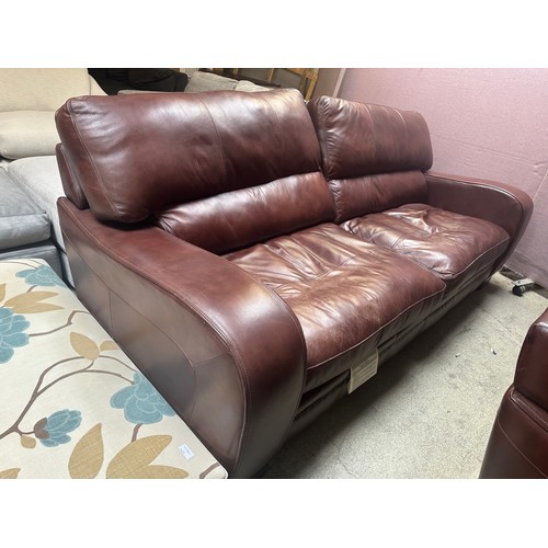 1520 - A cognac leather three seater sofa and two seater sofa