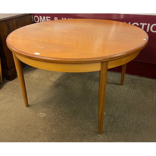 66 - A G-Plan Fresco teak circular extending dining table