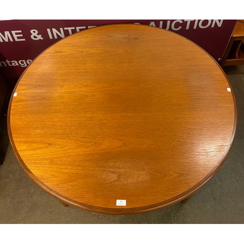 66 - A G-Plan Fresco teak circular extending dining table