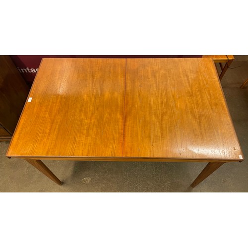 70 - A Younger teak sequence range extending dining table, designed by John Herbert