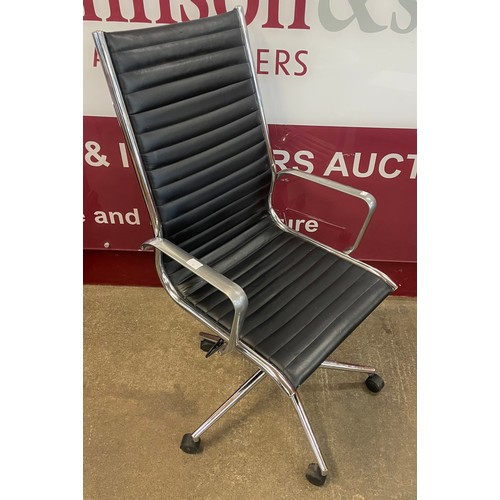 78 - An Eames style chrome and black leather revolving desk chair