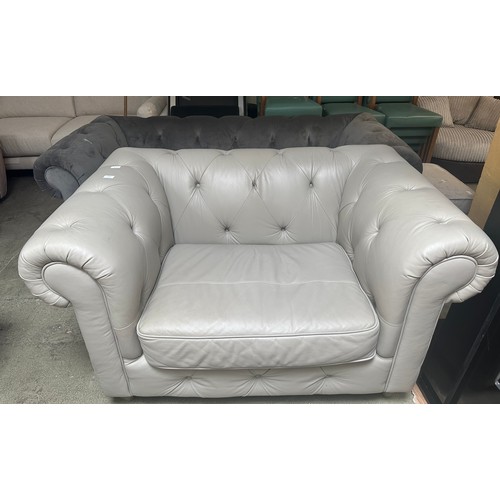 1538 - Stone leather Chesterfield two seater sofa RRP £1379 - damaged, and a grey velvet three seater Chest... 