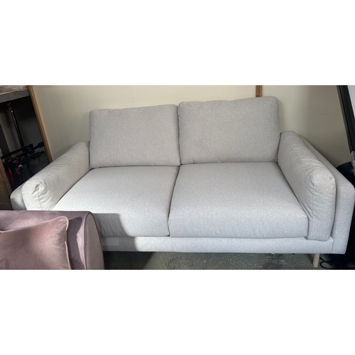 1540 - An oatmeal upholstered three seater sofa - minor damage