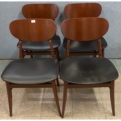 64A - A set of four teak and black vinyl dining chairs