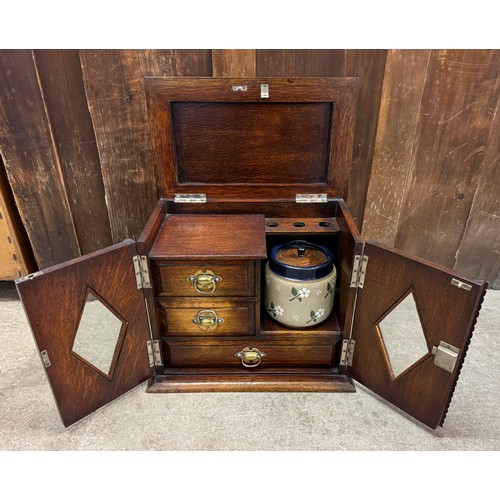 389 - An Edward VII oak smokers cabinet