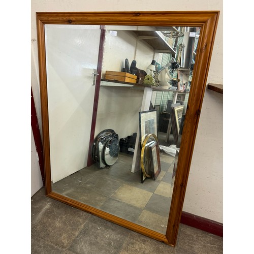 385 - A large pine framed mirror